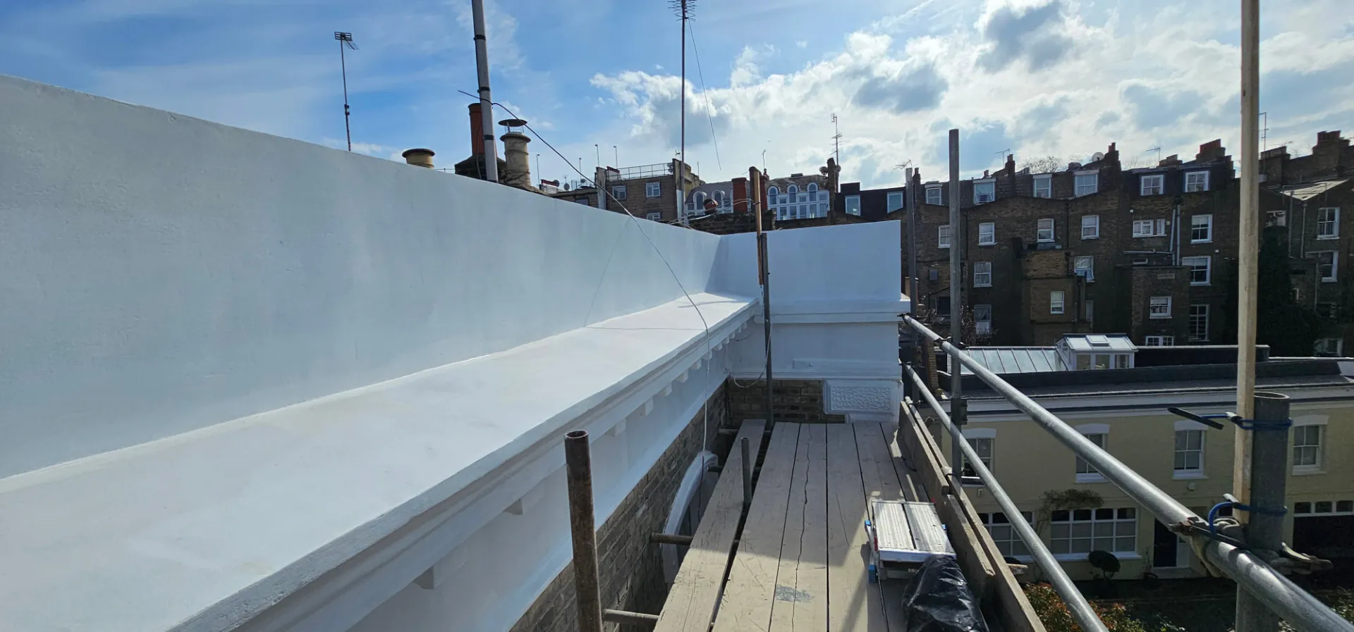 Reinstated parapet and cornice from the scaffold at Sunningdale Gardens
