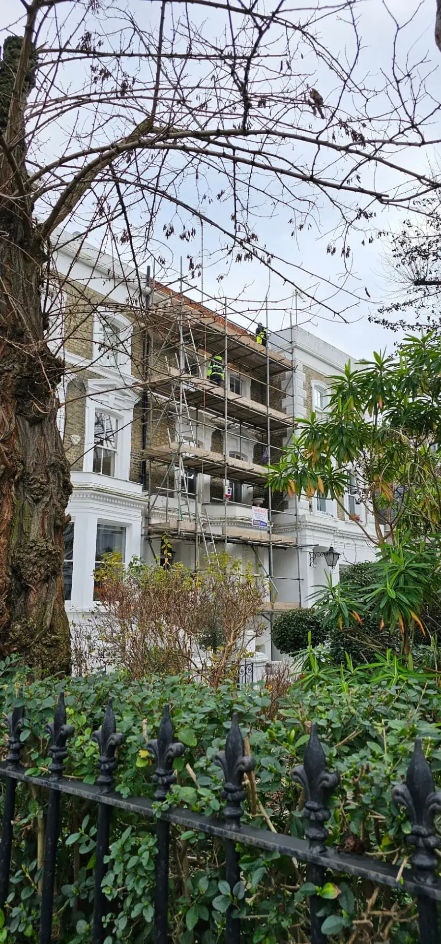 Full scaffold to the stucco elevation during works at Sunningdale Gardens, Kensington