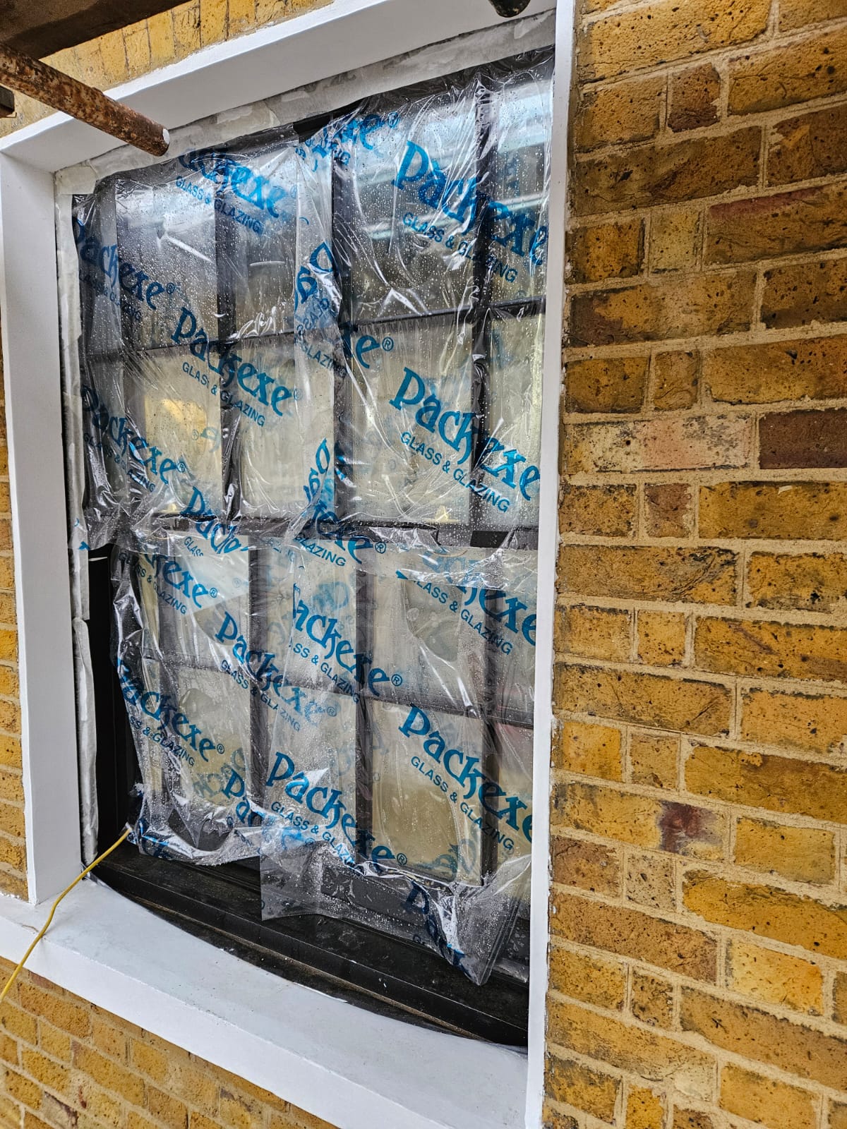 Completed window surround and repointed brickwork, Vauxhall SW8