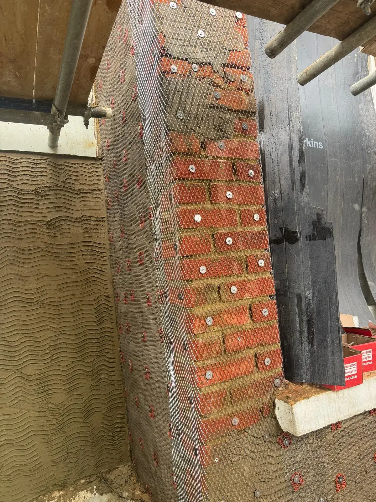 Reinforcing mesh fixed over the brickwork ahead of rendering at Wimbledon Village
