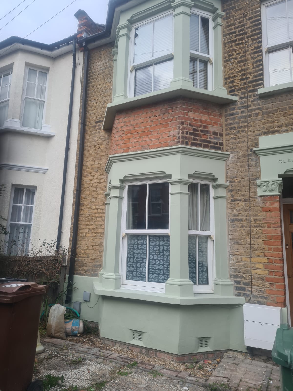 Repaired columns, cornices and sills to the bay window