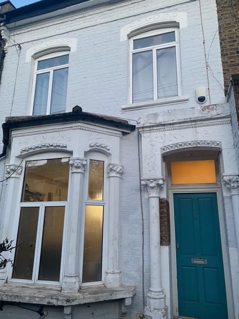 Neighbouring elevation showing original moulding detail before restoration