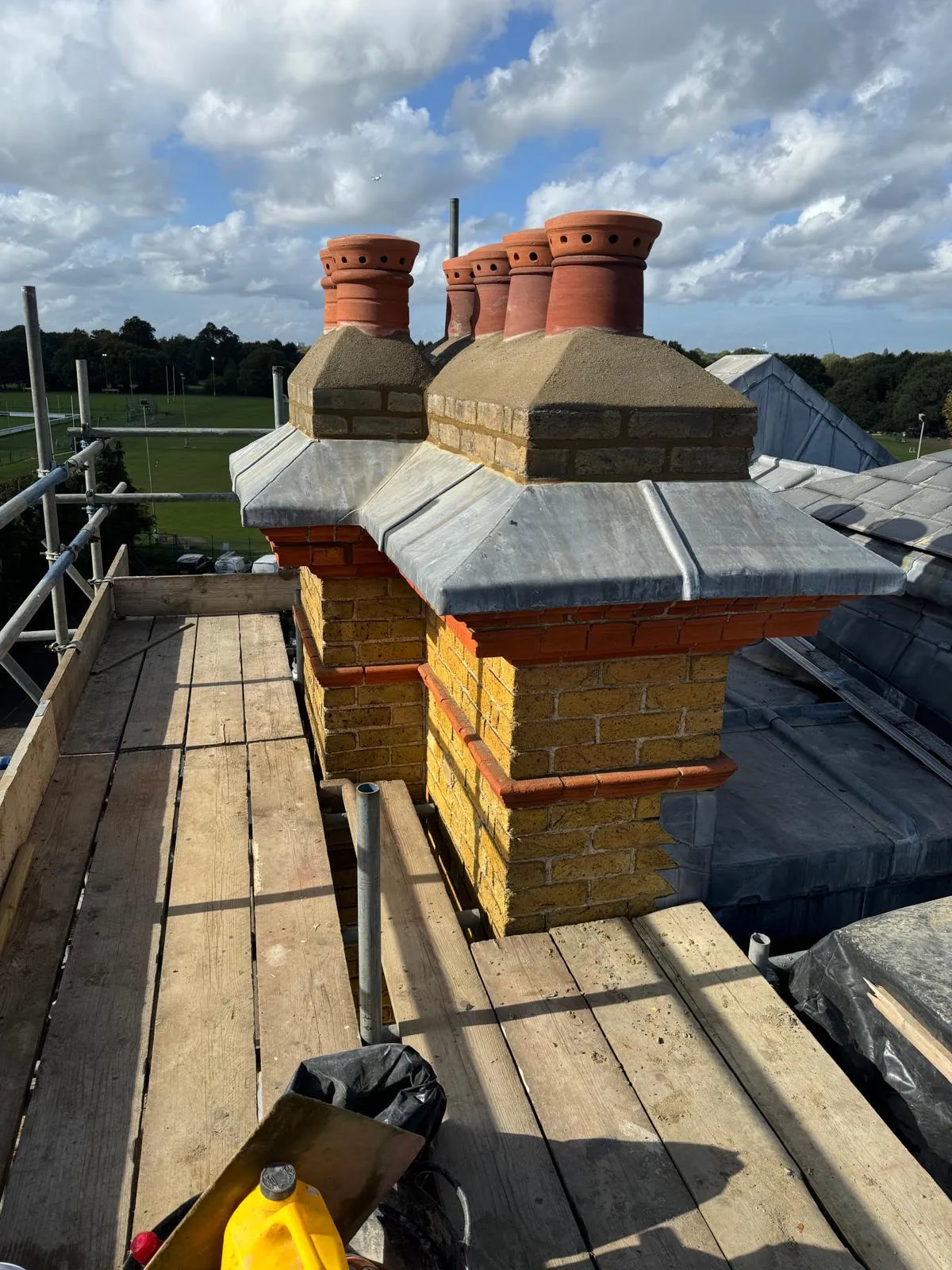 Renewed sand-and-cement flaunching across the restored chimney blocks at Richmond Royal Hospital
