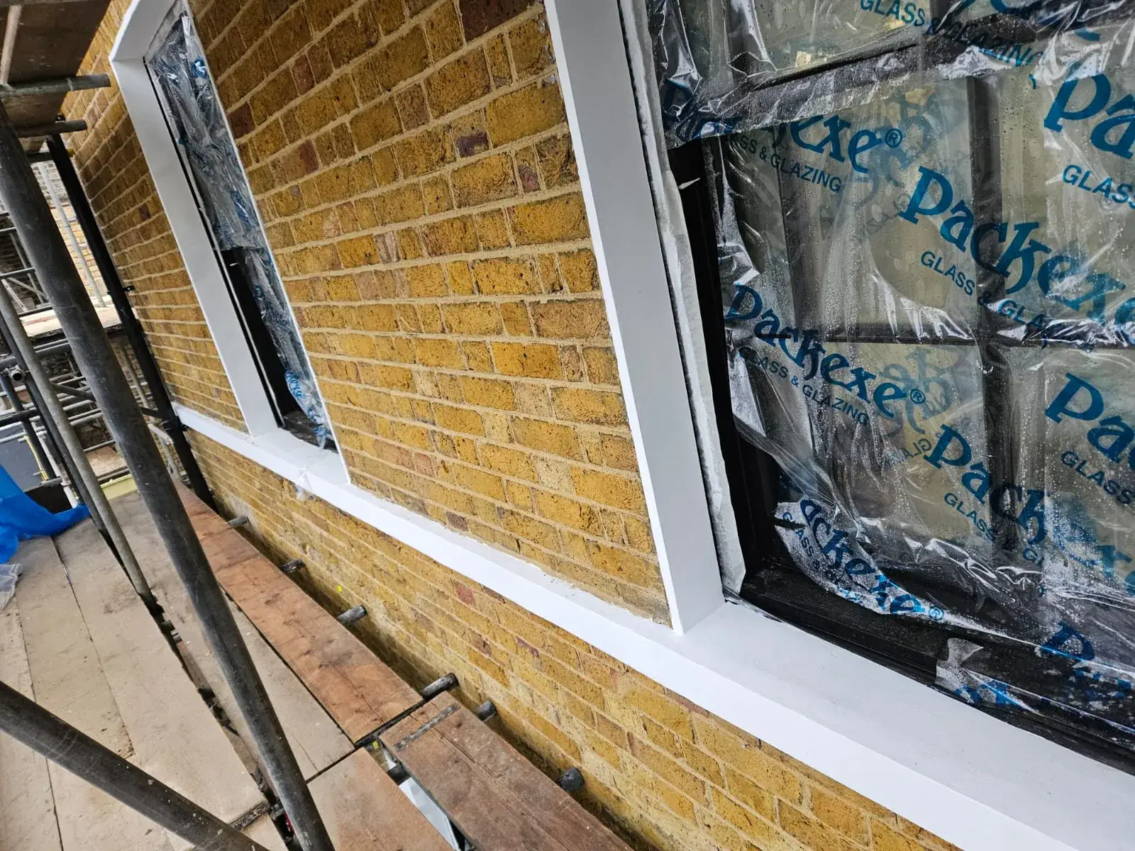 Repointed brickwork and new window surrounds from the scaffold