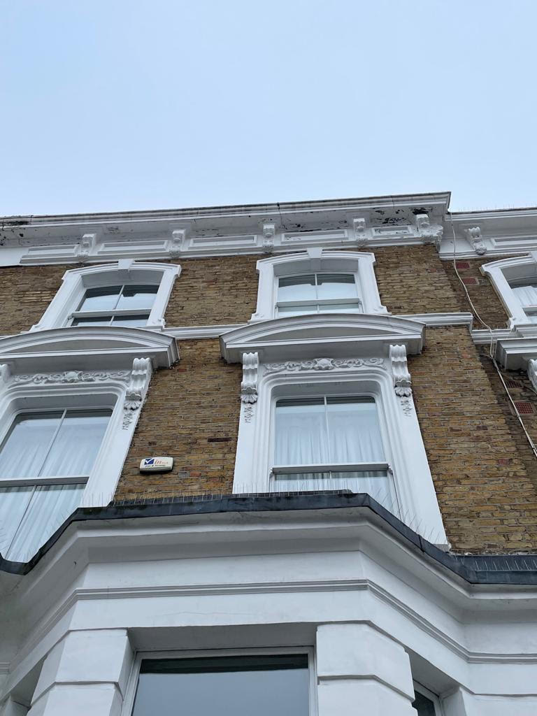 Window heads, brackets and cornice before repair, Notting Hill W11