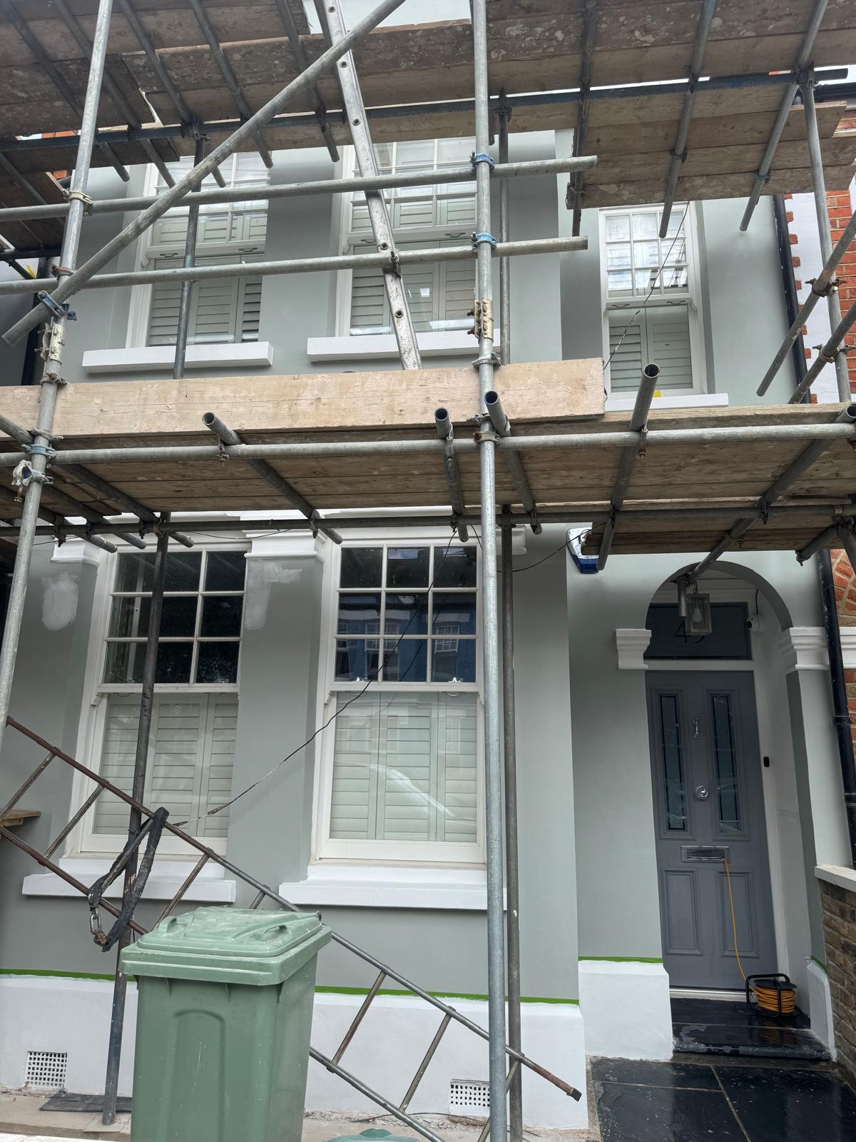 Scaffold view of the rendered and painted elevation during works at Wimbledon Village