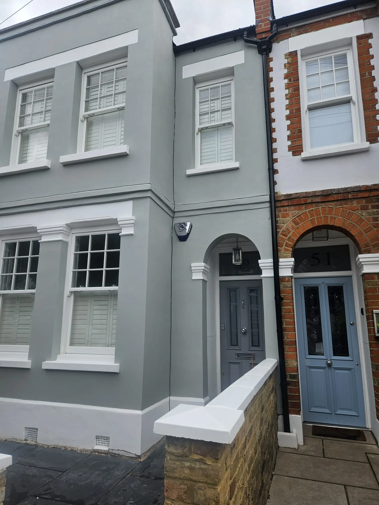 Completed front elevation with repaired mouldings and new paint, Wimbledon Village SW19